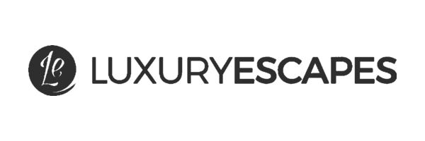 A black circular logo with stylized 'Le' lettering next to the text 'LUXURYSCAPES' in dark gray on a solid white background.
